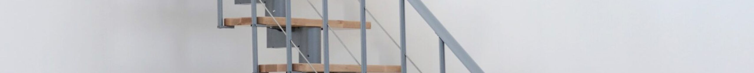 Modern Comfort Top staircase with a gray metal central stringer construction and beech wood steps.