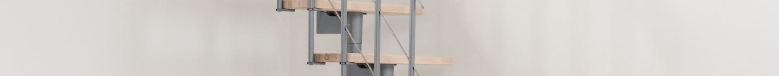 Central stringer staircase Style Turn with beech steps and a gray metal railing with understraps and a PVC handrail. The lower part features a turn to provide a space-saving solution.