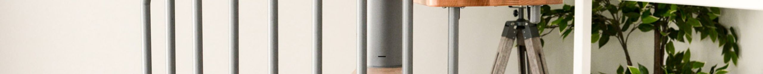 The Metallica spiral staircase combines a grey metal railing with light wooden steps. Perfect for modern living spaces and space-saving solutions, for example in children's rooms.