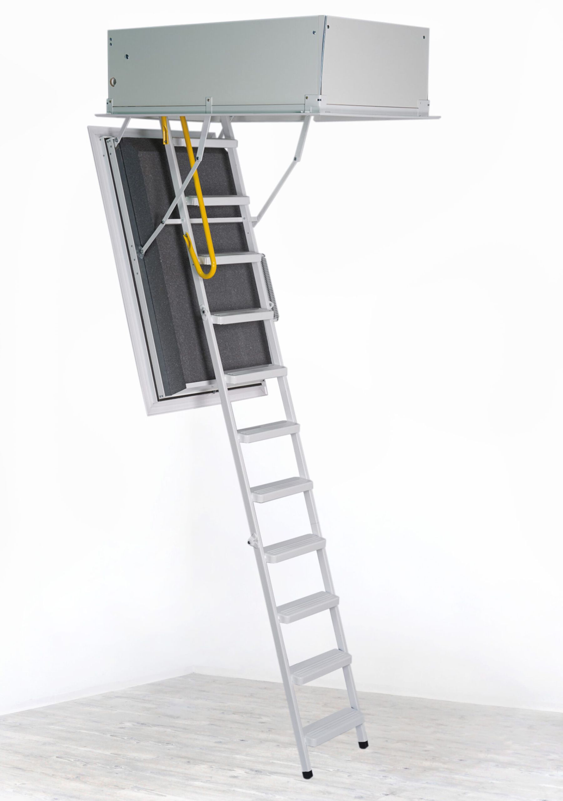 The image shows an attic ladder, which is typically used for accessing attics or loft spaces. The ladder is retractable, stored within a hatch in the ceiling.