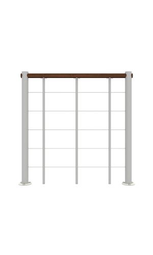 A toddler plays with colorful toys on the floor in front of the mounted "Annika" wooden child safety gate. The gate is installed between two walls, separating the play area from the kitchen behind.