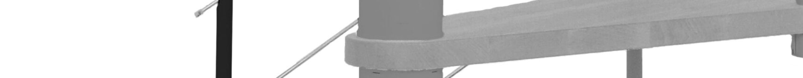 Height extension for the spiral staircase Venezia with steps in beech stained to walnut and black metal. Shown is a detail of the additional step, the balusters and the wooden handrail.