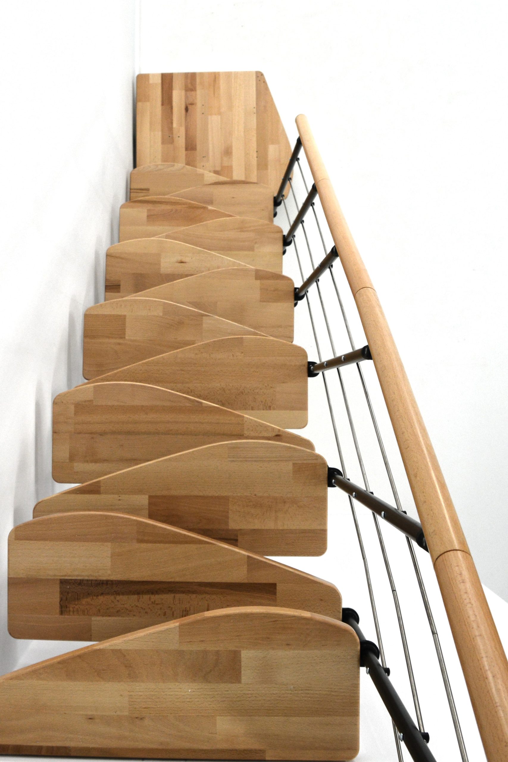 Quatro Turn central stringer staircase with quarter-turn winder beech steps, black metal railing with horizontal bars, and a wooden handrail, viewed from above.