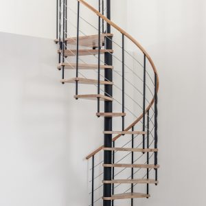 Spiral staircase Venezia with steps and handrail in beech wood, black metal parts and stainless steel bottom rails, installed in a white room.