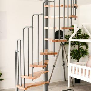 The Metallica spiral staircase combines a grey metal railing with light wooden steps. Perfect for modern living spaces and space-saving solutions, for example in children's rooms.