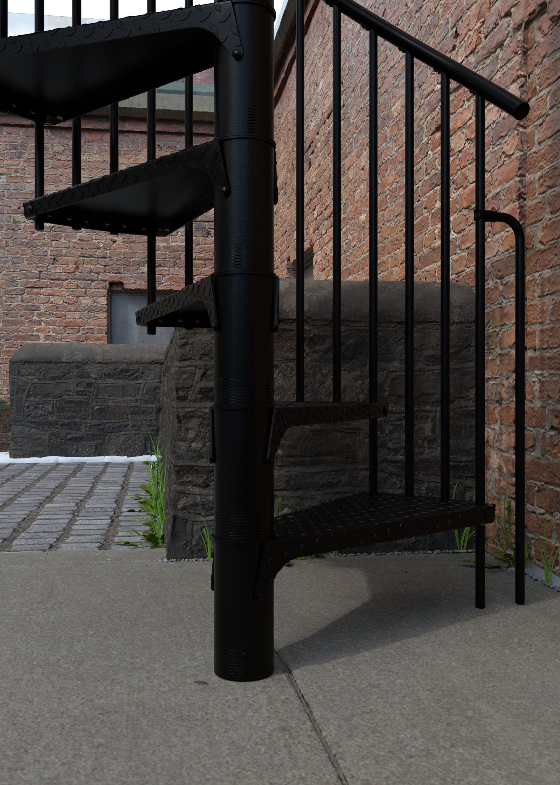Detail view of the outdoor spiral staircase Rondo Zink Color in black. The image shows the lower galvanized tear plate steps, vertical steel balusters, and round handrail, installed in an outdoor area in front of a brick wall.