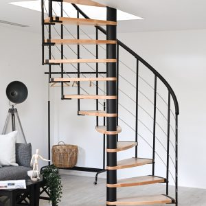 Helios spiral staircase in a modern living space. The elegant combination of light wooden steps and black metal creates a stylish and space-saving design. Perfect for open living concepts.