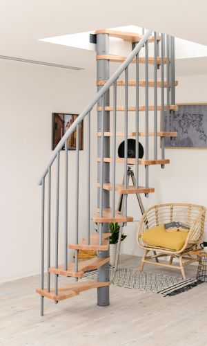 The Metallica Smart spiral staircase features a grey metal frame and light wooden steps, fitting perfectly into modern interiors. Compact design for stylish space-saving solutions.