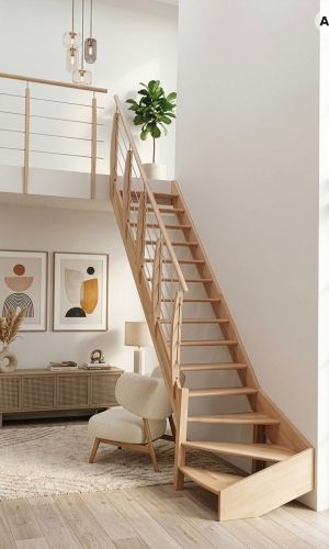 Classic Turn wooden staircase with a space-saving quarter-turn design, featuring solid timber treads, a matching wooden handrail, and stainless steel cable balustrades, elegantly integrated into a bright, modern living space.