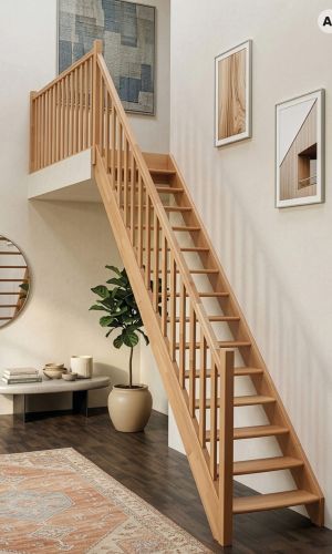 Classic straight staircase in solid beech wood featuring open risers, a traditional vertical spindle balustrade, and a matching handrail, creating a timeless and elegant feature in a bright, contemporary interior.